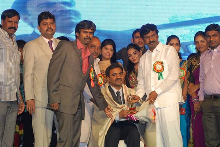 Best gastroenterology doctor in Hyderabad getting awarded at an award ceremony