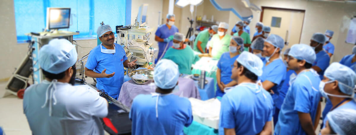  Picture of the best laparoscopic surgeon in Hyderabad talking with his team