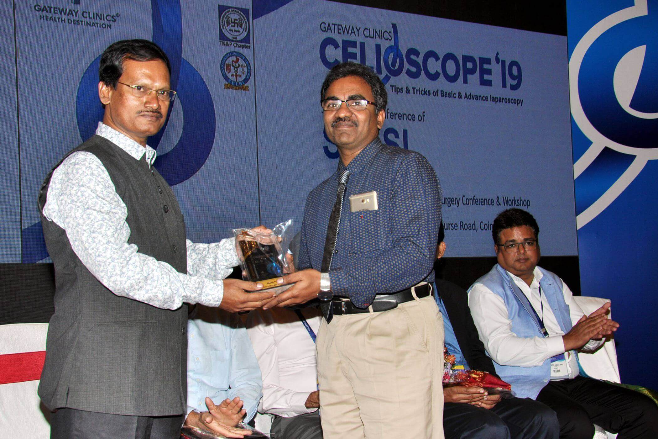best laparoscopic surgeon in Hyderabad receiving an award for being best in the field